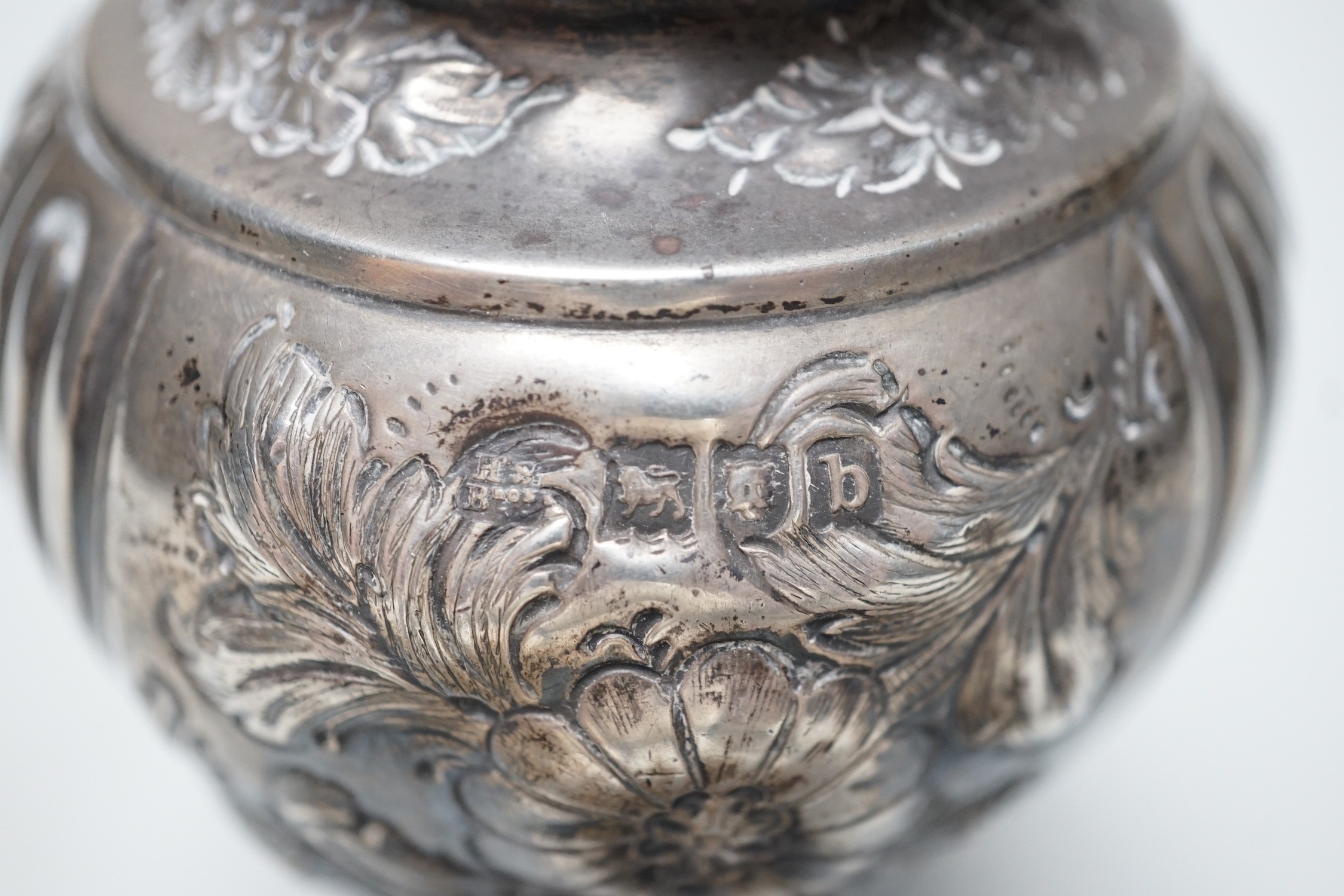 A late Victorian embossed silver inverted pear shaped sugar caster, Harris Brothers, London, 1897, 19.8cm, 7.5oz.